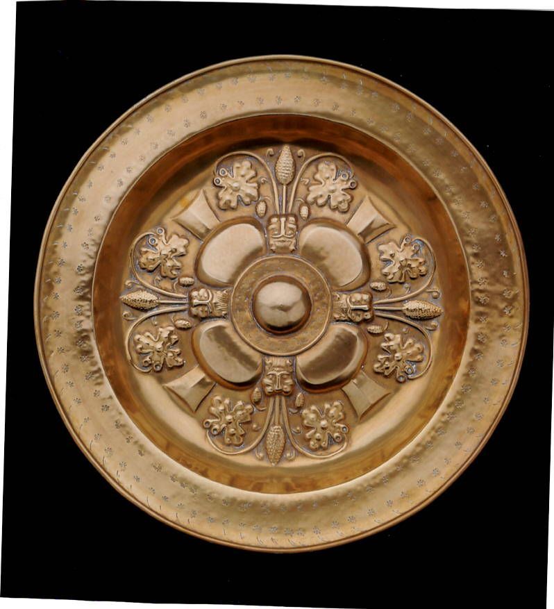Pair of gilded brass parade dishes, decorated with thistle flowers and leaves, Holland 16th century, diameter 50 cm.